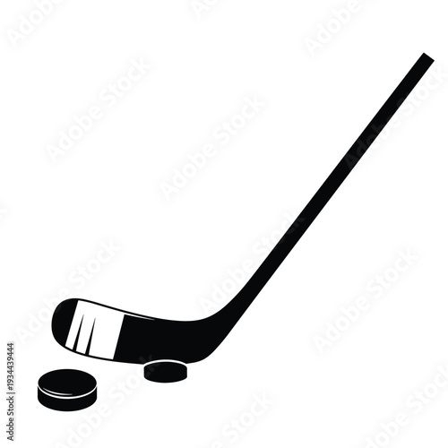 Black silhouette of a hockey stick and puck on a white background