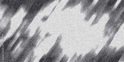 Dynamic monochrome abstract background with diagonal streaks of granular noise and blurred shapes, creating a sense of movement and energy for graphic design