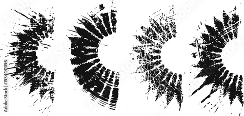 Circular black ink splatter grunge brushes in various radial patterns on white background