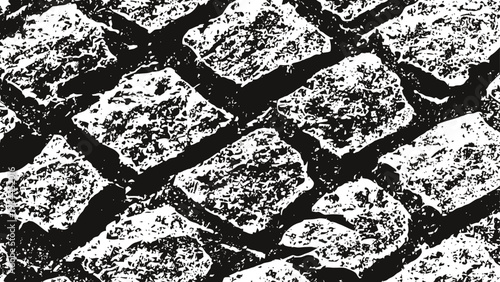 Close up texture of old weathered cobblestone pavement in black and white