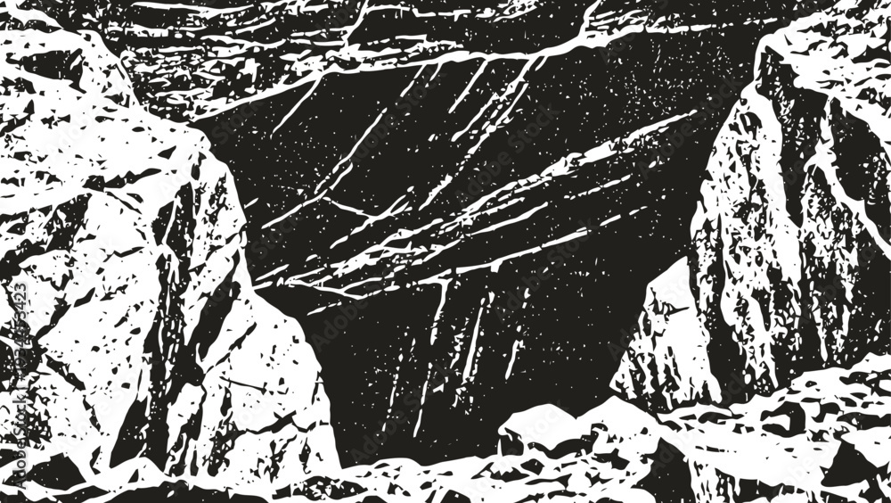Obraz premium Mountain canyon landscape with steep rocky cliffs and rugged terrain in monochrome