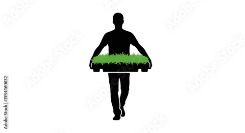 Silhouette of a person carrying a tray of sod or grass for landscaping
