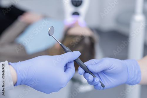 Konstfotografi Dentist holding dental mirror before teeth treatment