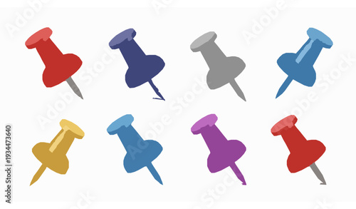 A set of colorful push pins on a white background