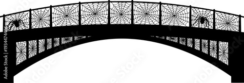 Spooky bridge railing features intricate spiderweb patterns and arachnid silhouettes