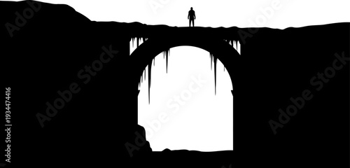 Solitary figure stands atop a dark stone arch bridge silhouette