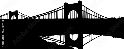 Suspension bridge silhouette with water reflection