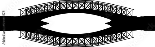 Symmetrical truss bridge silhouette creating an eye shape reflection