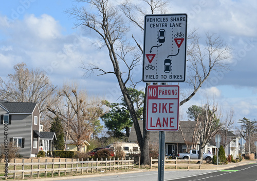 Signs for Vehicles Share Center Lane, Yield to Bikes and No Parking, Bike Lane