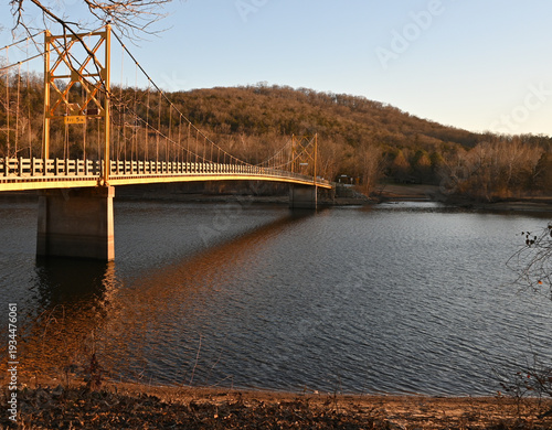 One-lane wooden suspension bridge, Beaver Bridge, over the White River in Arkansas