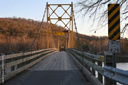 One-lane wooden suspension bridge, Beaver Bridge, over the White River in Arkansas
