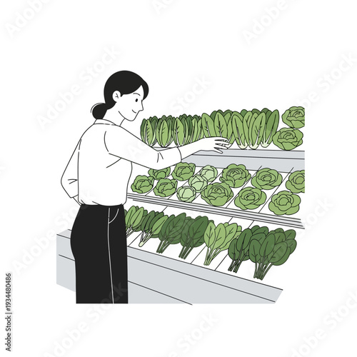 Woman choosing fresh lettuce and greens from a supermarket display shelf