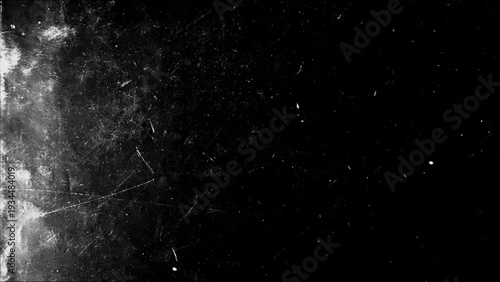 Monochrome horizontal grunge background featuring scratches, abrasions, and paint splashes from an artist's studio in a vintage setting.