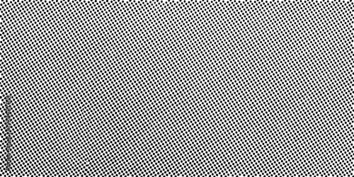 Dense pattern of small dark shapes against a bright white background