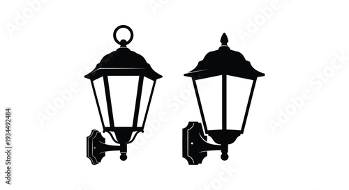 Two ornate vintage style wall lamps are depicted in stark black against a white background a striking silhouette