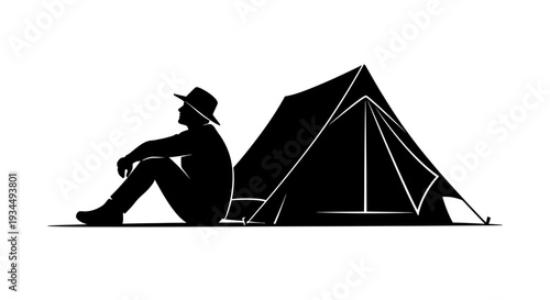 Man sitting next to a tent.