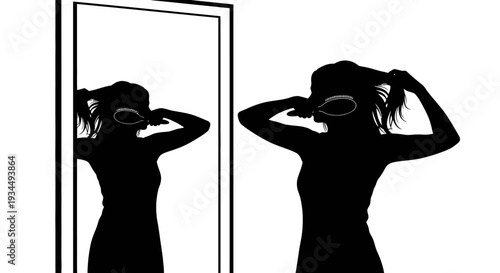 Silhouette of woman styling hair.