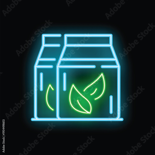 Bright neon sign showing two boxes of green tea, perfect for tea shops or any business looking for a vibrant, eye catching image