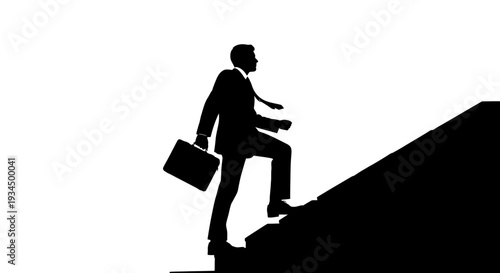 Businessman climbing up a steep slope.