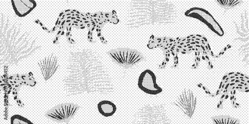 Black and white cheetah print with spots on textured background with plants
