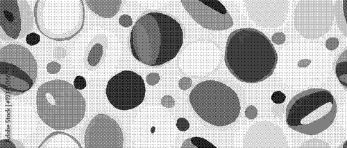 Black and with various sized circles and ovals