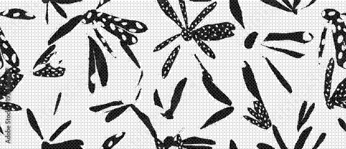 Black and white leaf pattern with various shapes and designs on fabric texture