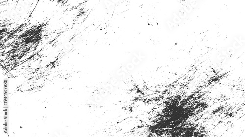 Black ink splatters and scratches on a white textured background abstract