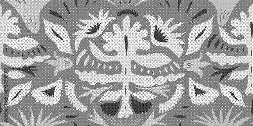 Gray and white floral pattern on fabric with intricate woven design