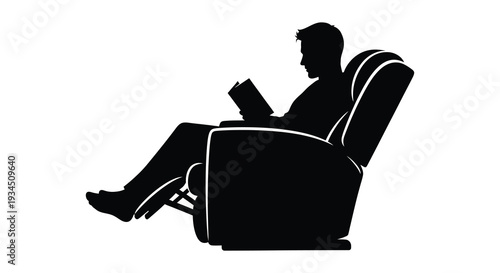 A relaxed man is deeply engrossed in reading a book while comfortably seated in an armchair silhouette