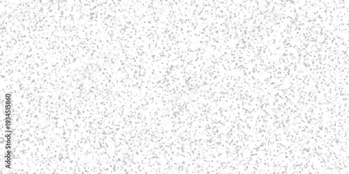 Abstract grey and white granular mosaic texture with a dense arrangement of small, uneven geometric elements for modern backgrounds and digital art applications