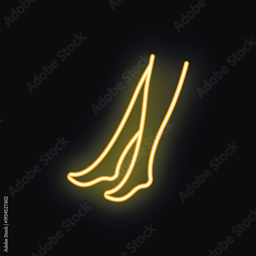 Golden neon sign representing woman legs wearing stockings on black background