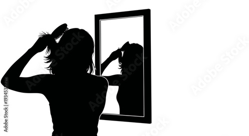 Woman styling hair in mirror silhouette.