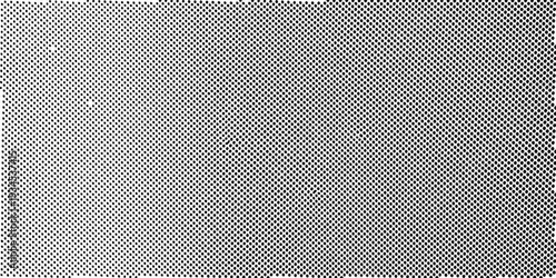 Close up view of a perforated metal surface with a diamond pattern