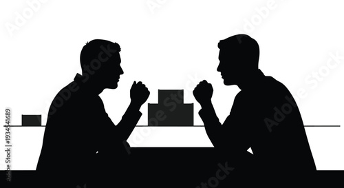 A black silhouette on a white background captures two men sitting at a table in a tense confrontation, with fists clenched over abstract blocks.
