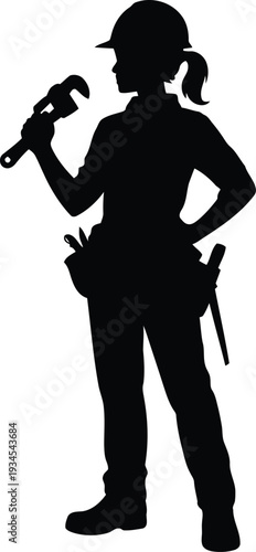 A female construction worker holding a wrench