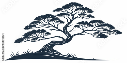 A majestic tree standing tall on a grassy hill with a clear sky in the background