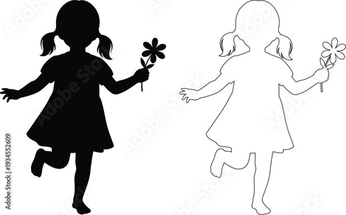 Two young girls dancing with flowers in their hands during a sunny day.