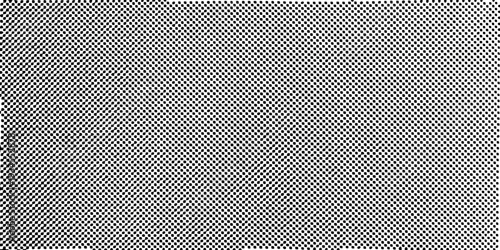 Close up of a black and white dotted pattern resembling perforated metal