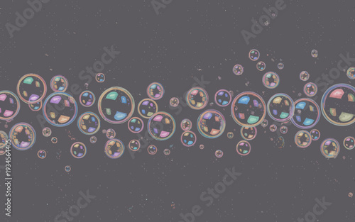 Many colorful soap bubbles floating in mid air on gray background