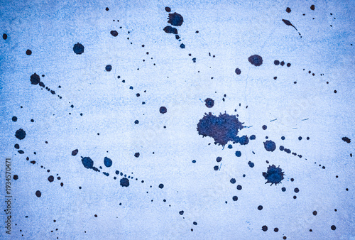Ink splash over vintage paper, blue watercolour splatter background.