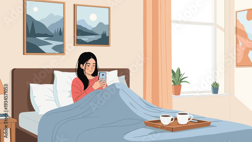 Relaxed young woman sits propped up in bed under a blue blanket while browsing on her smartphone during a peaceful morning.