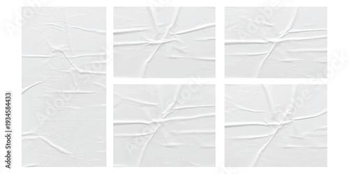 A collection of six wrinkled white paper textures with creases and folds on a white background