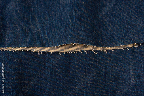 Obraz na płótnie Blue denim fabric as a background. Top view.