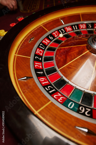 Casino theme, betting, online casino. image of red color casino roulette, poker game. roulette wheel. online casino, bets, winnings. Luxury roulette. close-up image