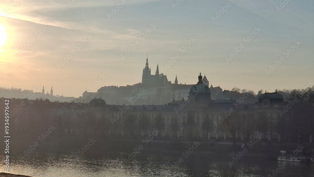 Fototapeta premium Scenic sunset view of Prague Castle and Vltava river 