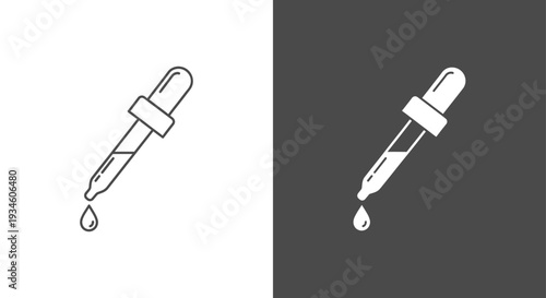 A dropper with a drop of liquid on the tip