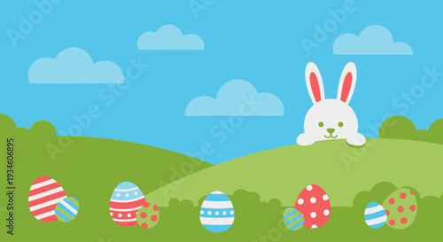 Cute White Easter Bunny Peeking from Grassy Hill with Various Patterned Eggs Under Clear Sky