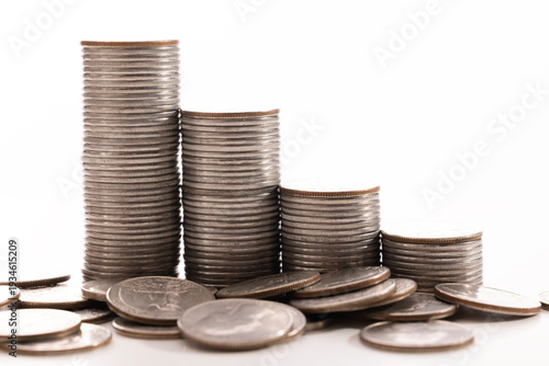 A stack of dollar coins stacked on each other in different positions. Money