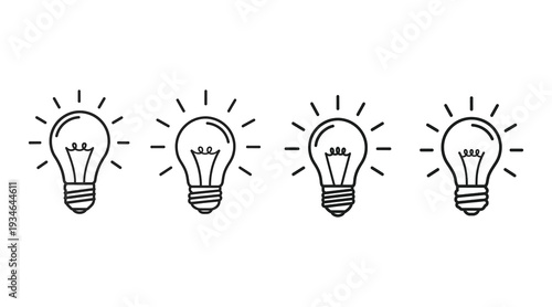 Four light bulbs with radiating lines representing ideas and inspiration