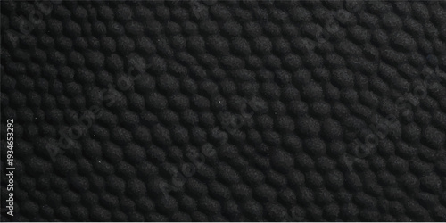 Black textured anti slip rubber matting with repeating circular pattern offering tactile surface design and abstract industrial background texture